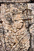 Chichen Itza - Great Ball court. Detail of the bas-reliefs on the side benches.