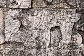 Chichen Itza - Great Ball court. Detail of the bas-reliefs on the side benches.