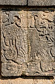 Chichen Itza - The Platform of the Eagles and Jaguars. Bas-relief of a eagle devouring the heart of a defeated victim.