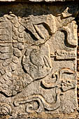 Chichen Itza - The Tzompantli. Bas-relief of a eagle devouring the heart of a defeated victim.