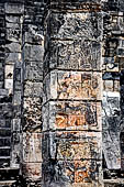 Chichen Itza - The temple of the Warriors. Pilasters at the entrance of the temple decorated with figures of gods and warriors.