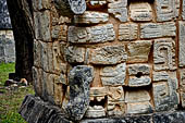 Chichen Itza - El Osario pyramid (the Ossuary) Part of the decoration of the top of the structure consisted of stacked masks in Puuc style. They may represent rain gods (Chac).