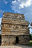 Chichen Itza - The Monjas (Nunnery) palace complex. La Iglesia (the church) this small building displays a profusion of 'big nosed' masks of Chac God.