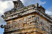 Chichen Itza - The Monjas (Nunnery) palace complex. La Iglesia (the church) this small building displays a profusion of 'big nosed' masks of Chac God.