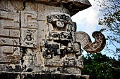 Chichen Itza - The Monjas (Nunnery) palace complex. Eastern patio, eastern facade of the church, the corner 'big nosed' mask.