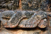 Chichen Itza - The group of el Osario (the Ossuary). Plataforma de las Tumbas. Detail of the frieze with intertwining serpents.