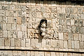 Chichen Itza - The Templo de los Guerreros (Temple of the Warriors). Detail of the southern wall with panels of a plumed serpent with the opened jaws from which emerge a carved human head.