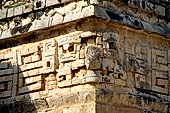 Chichen Itza - The Monjas (Nunnery) palace complex. Eastern patio, eastern facade of the church, the corner 'big nosed' mask.