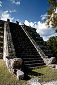 Chichen Itza - El Osario (the Ossuary) or the High Priest's Grave pyramid. Stairway balustrade decorated with intertwining serpents. 