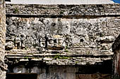 Palenque - The Palace. Glyph-alike ventilation opening on House E.