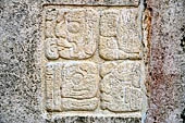 Palenque - The Palace. Patio of the Captives (Patio de los Cautivos), images at base of House C, glyph caption of the second captive from left.