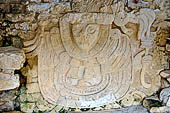 Palenque - the North Group, modelled stucco at the base of temple II showing a personage of the insignia of Tlaloc.