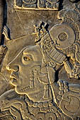 Palenque - The archaeological Museum, stone tablet from Temple XIX. This detail depicts a vassal of K'inich Ahkal Mo' Nahb' III supporting the ruler on a ceremonial regalia. 