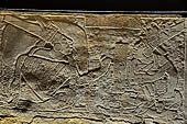 Portion of the western side of the throne found in Temple XIX. It shows regional lords offering the insignia of power to Ahkal Mo' Nahb. 