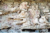 Palenque - The Palace, stucco bas-reliefs of the Northern stairway, this detail represents K'awiil (God K) emerging from the open jaws of a double headed serpent.