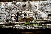 Palenque - The Palace. Glyph-alike ventilation opening on House E.