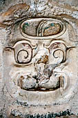 Palenque - The Palace. House C. Photographs of the best preserved of the nine masks on the inner wall of the west corridor.