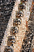 Uxmal - The Magician's Pyramid (el Adivino).The western staircase is flanked by stylized Chac masks.