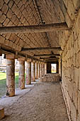 Uxmal - The Quadrangle of the Birds (Cuadrangulo de los Pajaros), the South building colonnaded gallery with wooden lintels and cross beams. 