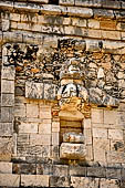 Uxmal - The Nunnery Quadrangle. The West building. Frieze over doorway no.3: figure showing treated hair.