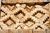 Uxmal - The Nunnery Quadrangle, the North Building. Latticework of the frieze of the facade.