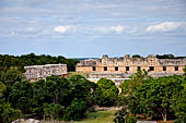 Uxmal - The Nunnery Quadrangle. The North Building and the West building emerge behind the trees.