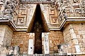 Uxmal - Palace of the Governor, front (East) facade. Vaulted passageway and mask stacks