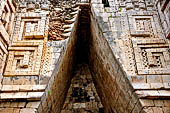 Uxmal - Palace of the Governor, front (East) facade. Vaulted passage way. 