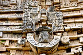 Uxmal - Palace of the Governor, front (East) facade. Detail of the frieze over the main doorway representing Lord Chaak with elaborate feather headdress.