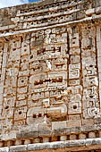 Uxmal - The Nunnery Quadrangle. The Eastern building. The masks stack over the central doorway.