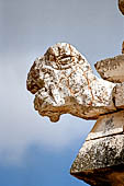 Uxmal - The Nunnery Quadrangle. The Eastern building. Detail of projecting tortoise head from the frieze of the  NW corner.  