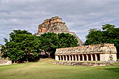 Uxmal - The Magician's Pyramid (el Adivino) with the colonnaded temple of the Iguana in the foreground