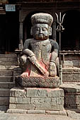 Bhaktapur - Tachupal Tole. Dattatraya Temple. Statue of wrestlers guarding the temple.