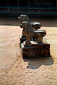 Bhaktapur - Durbar Square - two isolated lion statues in the middle of the east end of the square. 