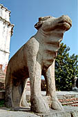 Bhaktapur - Durbar Square - Fasidega Temple (Shiva) on the eastern esplanade of the square, a white sikkara  on top of a platform with stairway flanked by cows and elephants. 