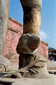 Bhaktapur - Durbar Square - Fasidega Temple (Shiva) on the eastern esplanade of the square, a white sikkara  on top of a platform with stairway flanked by cows and elephants. 