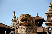 Bhaktapur - Durbar Square - detail of one of the two isolated lion statues of the east end of the square. 