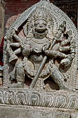 Bhaktapur - Taumadhi Tole - Nyatapola Temple. Statue of Singhini goddess at the top of the stairway. 