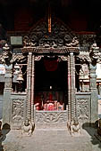 Bhaktapur - Golmadhi Square, where there is a deep hiti and the small three tiered temple dedicated to Golmadhi Ganesh and, nearby, a white chaitya.