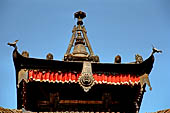 Bhaktapur - Golmadhi Square, where there is a deep hiti and the small three tiered temple dedicated to Golmadhi Ganesh and, nearby, a white chaitya.