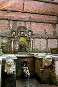 Bhaktapur - Golmadhi Square, where there is a deep hiti and the small three tiered temple dedicated to Golmadhi Ganesh and, nearby, a white chaitya. 