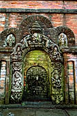 Bhaktapur - Golmadhi Square, where there is a deep hiti and the small three tiered temple dedicated to Golmadhi Ganesh and, nearby, a white chaitya. 