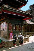 Bhaktapur - Golmadhi Square, where there is a deep hiti and the small three tiered temple dedicated to Golmadhi Ganesh and, nearby, a white chaitya. 