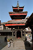 Bhaktapur - Golmadhi Square, where there is a deep hiti and the small three tiered temple dedicated to Golmadhi Ganesh and, nearby, a white chaitya. 