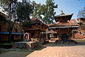 Changu Narayan - the SW corner of the courtyard with the Laxmi Narayan temple in the background and the small two storied pagoda Kileshwor temple.