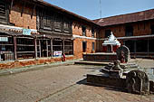 Changu Narayan - the NE corner of the courtyard. On the foreground the platform with the stele with Vishnu. Behind a second platform with the stele of Laksmi-Narayana.