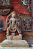 Changu Narayan - stone figure on the east facade the temple, left side of the doorway. 