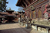 Changu Narayan - the South side of the main temple guarded by a pair of elephant statues. 