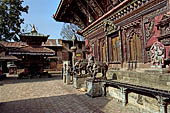 Changu Narayan - the South side of the main temple guarded by a pair of elephant statues.