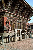 Changu Narayan - the South side of the main temple guarded by a pair of elephant statues.